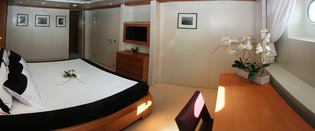 VIP cabin with queen size bed and writing desk